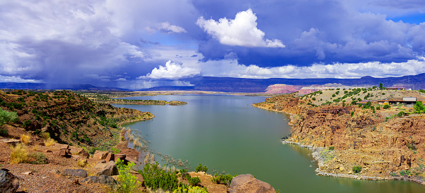 Aerial view of Owyhee Dam across Owyhee Lake on sunny day, Oregon, USA.