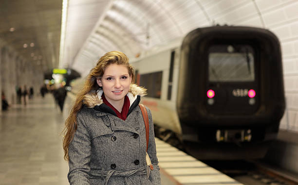 istock Woman and train at station 181130387
