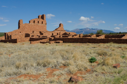 The Mission San Gregorio de Abo stands on a grassy field at the base of the Manzano Mountains in central New Mexico.  It is part of the Salinas Pueblo Missions National Monument.  Created from surround Abo sandstone, Abo was first inhabited in the 1300's, with this structure being built in 1629.  By the pueblo revolts of the late 1670's, both Native American people and Spaniard Franciscan monks left the area, leaving in their wake this amazing Christian mission, filled with rooms and kivas, along with man unexcavated mounds.