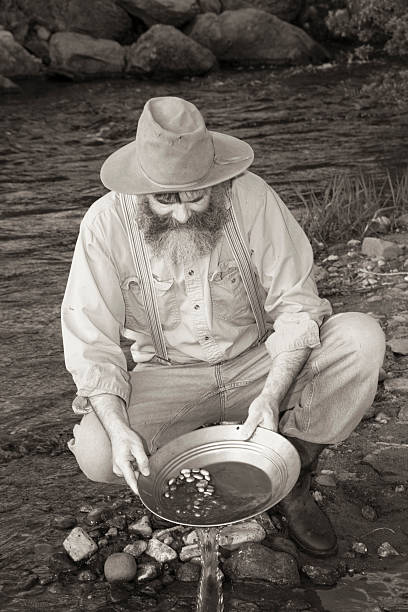 istock Man Panning For Gold In A Stream 181130542