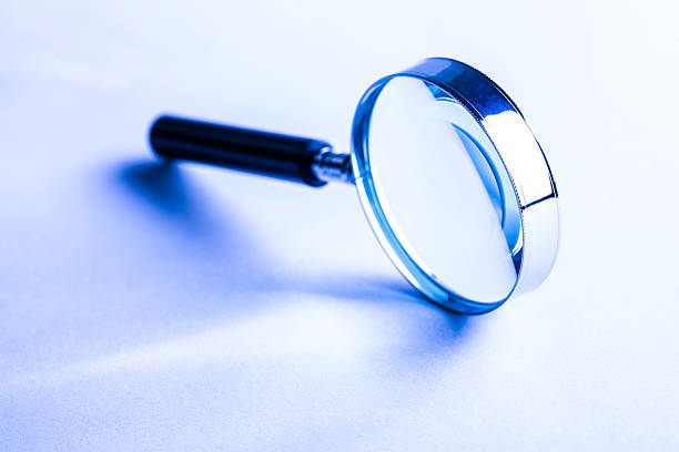 A magnifying glass tipped on its side stock photo