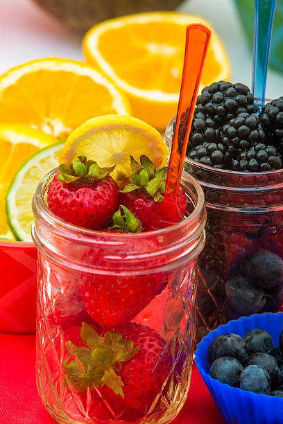 mason jar of strawberries and blackberries