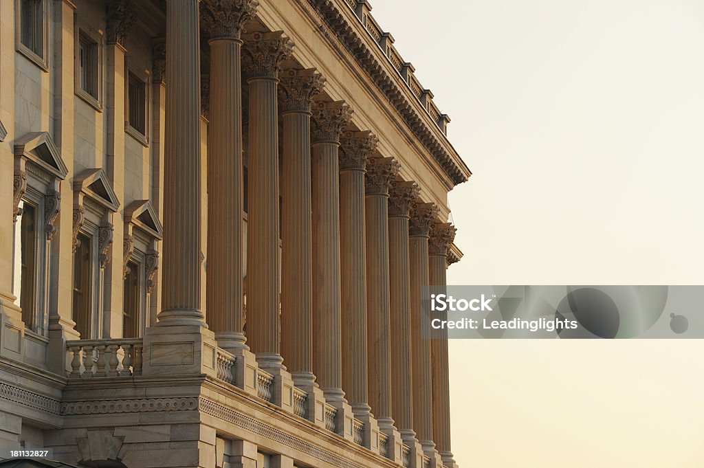 Capitol of the United States Columns on the north side of the Senate Chamber of the US Capitol building, late evening, low sun. Architectural Column Stock Photo