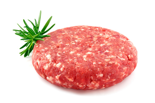 Raw minced beef isolated on a white background.