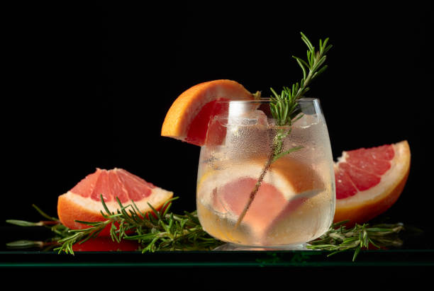 istock Cocktail gin tonic with ice, grapefruit, and rosemary. 1811339314