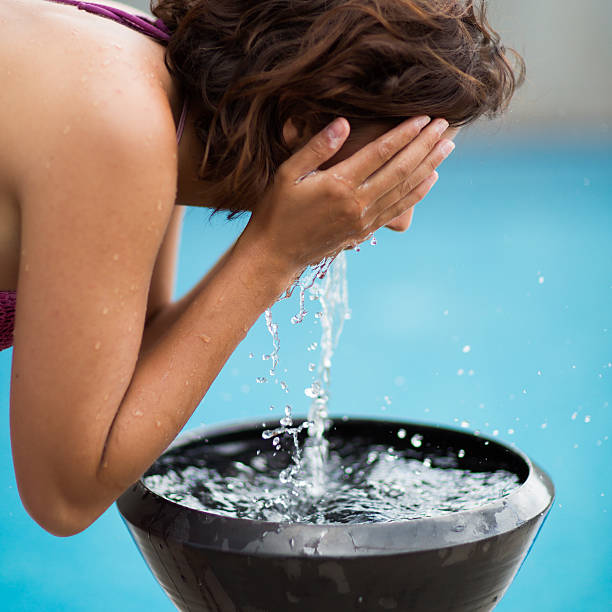 istock Woman Splashing Water On Her Face 181134131