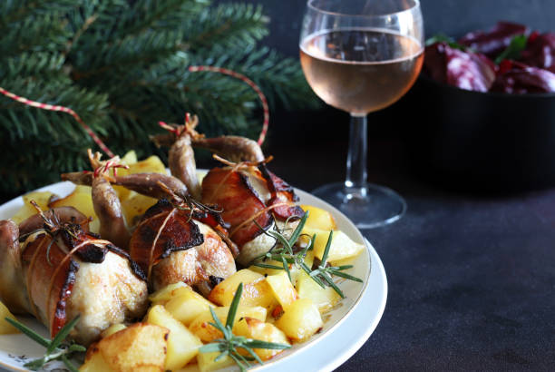istock Baked quails with potatoes, festive background. 1811343125