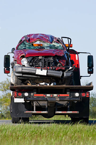 istock SUV on rollback tow truck 181134648