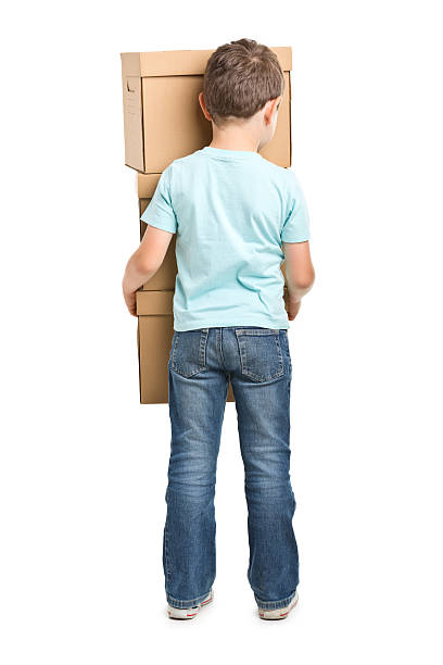 istock portrait of small boy with boxes 181134993