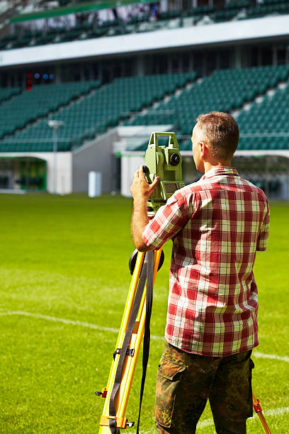 istock Land surveyor on sport arena 181135371