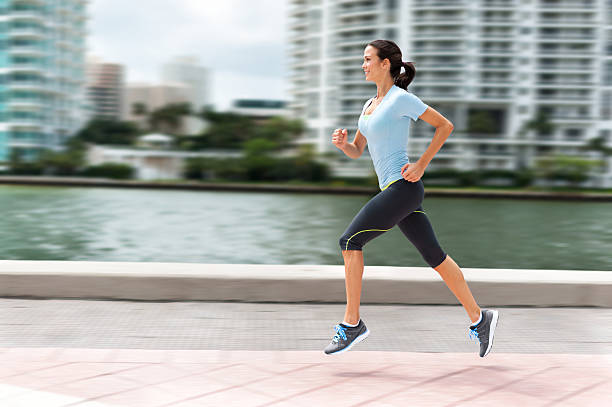 Young Woman Running in City Environment