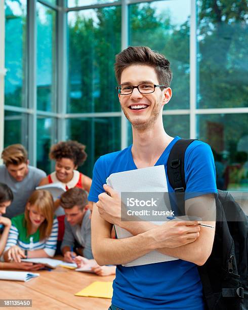 Foto de Alegre Aluno De Universidade e mais fotos de stock de Moderno - Moderno, Sala de aula, Sala de aula de universidade