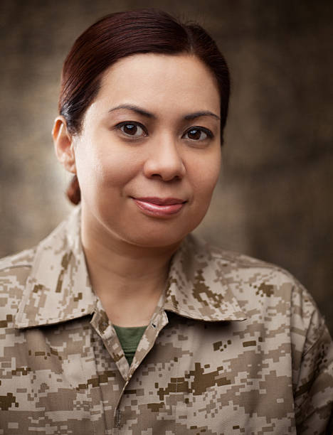istock US Marine Female Soldier in Combat Gear 181135596