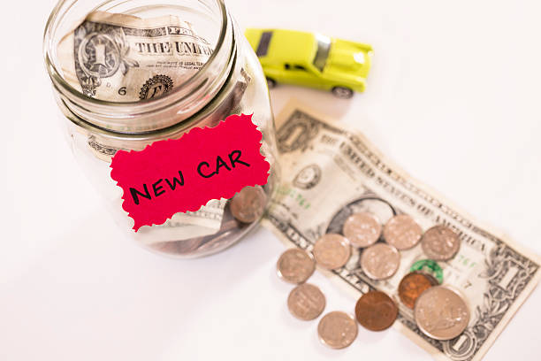 istock Consumerism:  Money Jar.  Saving for new vehicle. 181136234