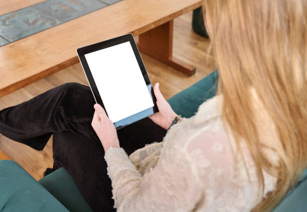 istock Woman looking at tablet 1811362372