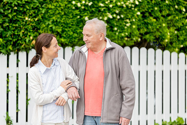istock Senior man with caregiver 181136243