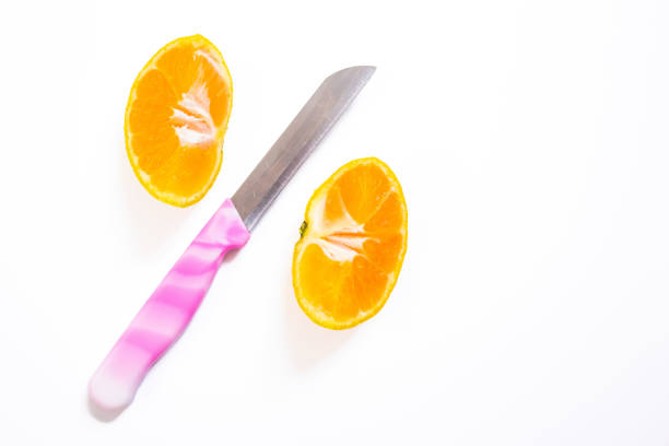 A close-up of fresh oranges placed on a vibrant blue background. The rich contrast between the bright orange fruit and the vivid blue surface highlights the freshness and appeal of the citrus, making it perfect for use in food and drink-related marketing, healthy lifestyle promotions, or vibrant product designs