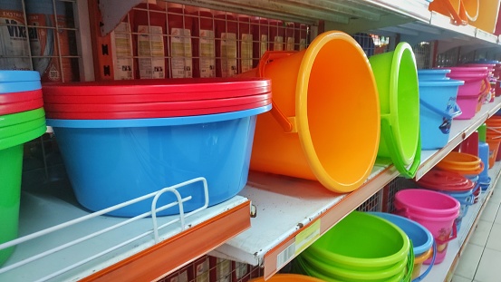 Colorful bucket displayed on the shelf in supermarkets to attract the customer to buy