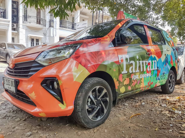 vehicle wrap advertisement Jakarta, Indonesia - September 29, 2023 : vehicle wrap advertisement with the words Taiwan for everyone. one way to promote tourism Taiwan in Indonesia commercial car wrap stock pictures, royalty-free photos & images