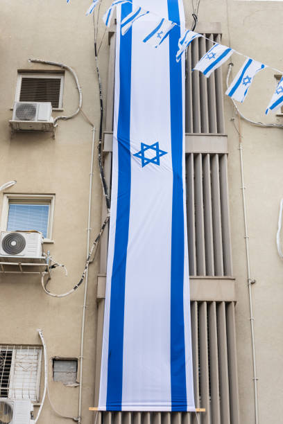 istock Multi-story hanging Israeli flag 1811373970