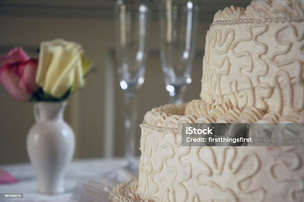 wedding cake 1 wedding cake in front of champeign glasses and vase of roses Bride Stock Photo