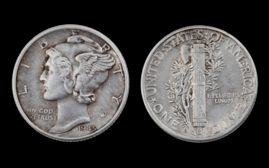 1945 Silver Mercury Dime isolated on black.