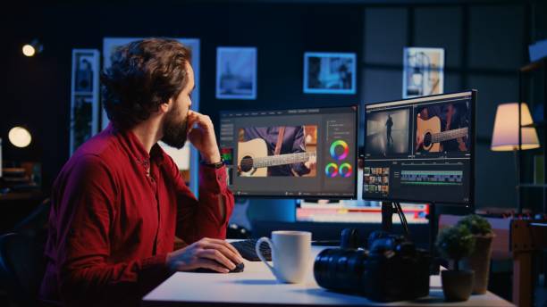 istock Videographer assembling recorded footage into finished project, panning shot 1811387304