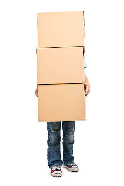 istock portrait of small boy with boxes 181138827