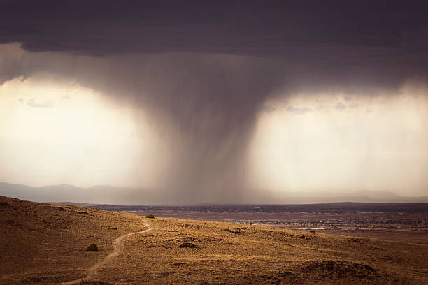 Storm Over Albuquerque A summer storm hits the southwestern city of Albuquerque in New Mexico (USA). Captured from the Volcanoes west of the city. albuquerque volcanoes stock pictures, royalty-free photos & images