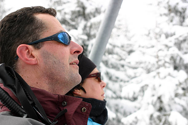 istock Man and woman in snow elevator 181139207