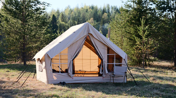 istock Big glamping camping tent in natural setting. Inflatable tent as a home 1811394959