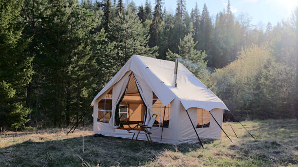 istock Big glamping camping tent in natural setting. Inflatable tent as a home 1811394974