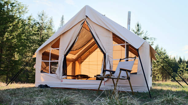 istock Big glamping camping tent in natural setting. Inflatable tent as a home 1811394983