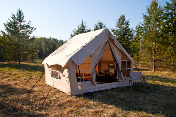istock Big glamping camping tent in natural setting. Inflatable tent as a home 1811395498