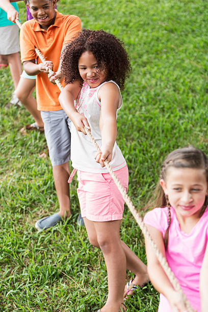 istock Children playing tug of war 181139551