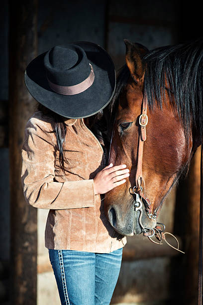 istock Cowgirl with Horse 181139657