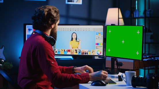 Content specialist using graphic design skills to make social media post on green screen computer for advertising company. Photo editor using chroma key PC monitor to create promotional image