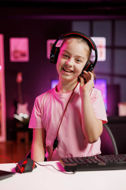 istock Media star kid testing audio listening device for viewers, presenting gaming headphones 1811408644