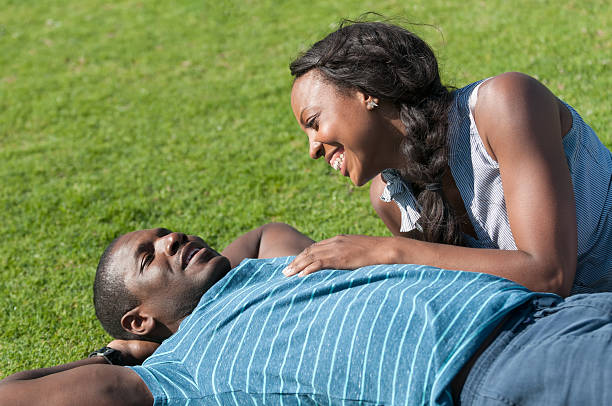 istock Happy Young African American Couple Lying on Grass 181140986