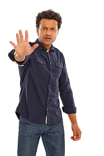 istock Middle aged man gesturing stop sign over white 181141259