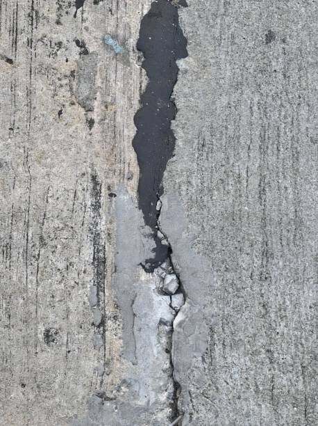 istock a crack in a concrete wall. 1811416437