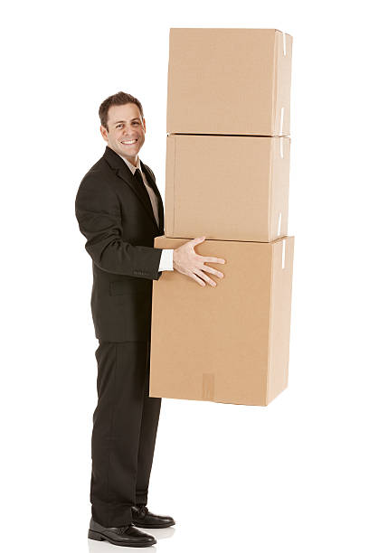 istock Businessman carrying cardboard boxes 181141725