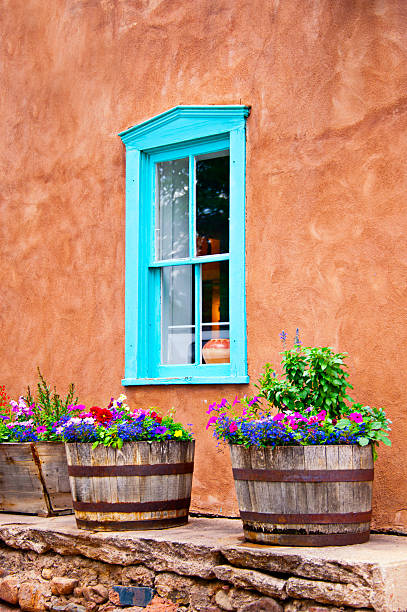 istock Santa Fe Old Adobe House with Stucco Wall and Flowers 181141731
