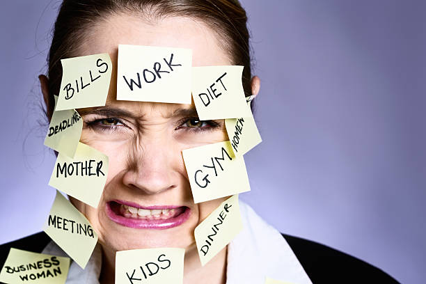 istock Enough multi-tasking! Angry woman covered in task reminders grimaces angrily 181141832