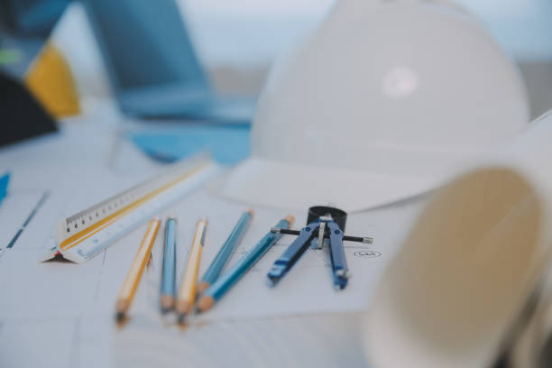istock Construction and structure concept of Engineer or architect meeting for project working with partner and engineering tools on model building and blueprint in working site, contract for both companies. 1811419933