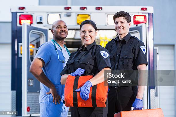 Paramedics And Doctor Outside Ambulance Stock Photo - Download Image Now - Emergency Services Occupation, Paramedic, Ambulance