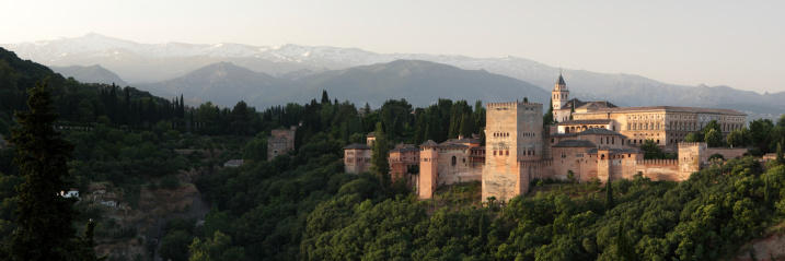 Panoramic view of Alhambra palace with snow-capped Sierra Nevada in the background, Granada, Spain. June, 2013. It was shot from Albaicin.