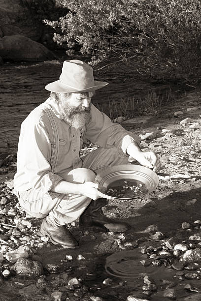 istock Man Panning For Gold In A Stream 181142613