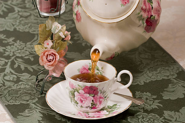 istock Hot tea being poured into a cup 181142851
