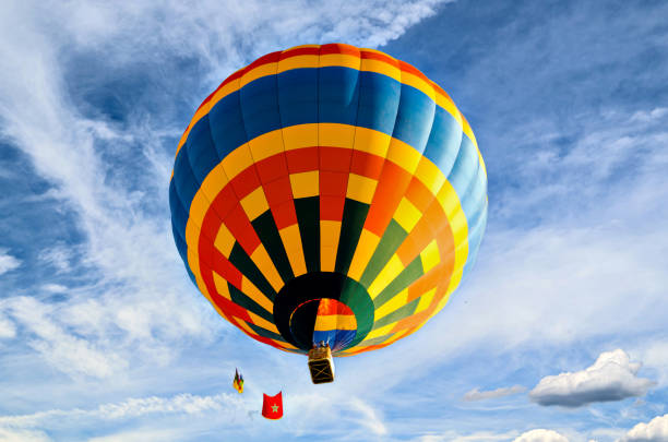 istock Hot air balloon flight over blue sky 1811428809